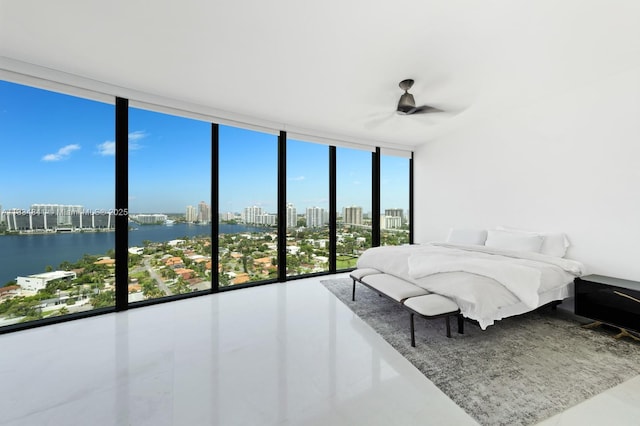 18555 Collins Ave Unit 2003, Sunny Isles Beach, FL 33160 - bedroom featuring floor to ceiling windows, a skyline view, a water view, ceiling fan, and tile patterned flooring