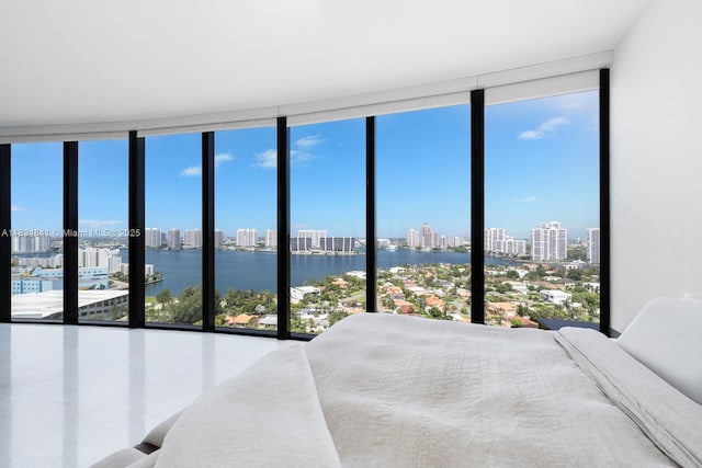 18555 Collins Ave Unit 2003, Sunny Isles Beach, FL 33160 - bedroom with floor to ceiling windows, a view of skyline, multiple windows, and a water view
