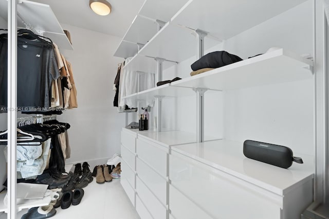 18555 Collins Ave Unit 2003, Sunny Isles Beach, FL 33160 - walk in closet featuring tile patterned flooring