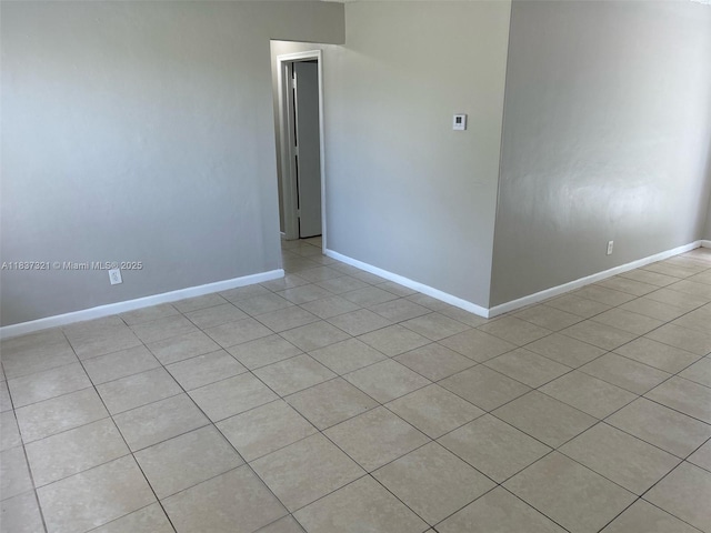 4021 NW 7th Ave, Deerfield Beach, FL 33064 - spare room featuring light tile patterned flooring and baseboards