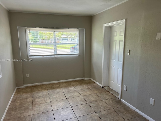 4021 NW 7th Ave, Deerfield Beach, FL 33064 - spare room featuring plenty of natural light, ornamental molding, and light tile patterned floors