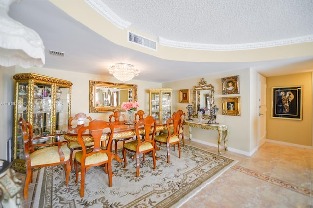 2751 S Ocean Dr Unit 1707S, Hollywood, FL 33019 - dining room featuring a textured ceiling and a chandelier