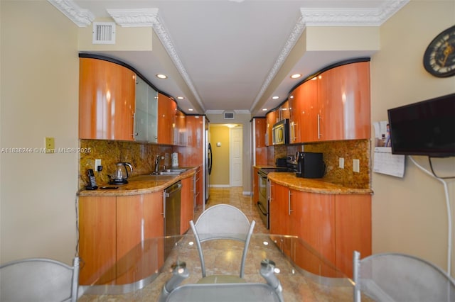 2751 S Ocean Dr Unit 1707S, Hollywood, FL 33019 - kitchen with appliances with stainless steel finishes, decorative backsplash, recessed lighting, ornamental molding, and arched walkways