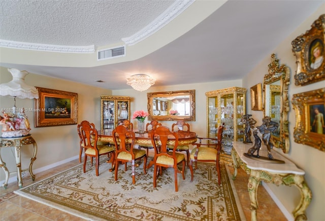 2751 S Ocean Dr Unit 1707S, Hollywood, FL 33019 - dining space featuring a textured ceiling and tile patterned flooring
