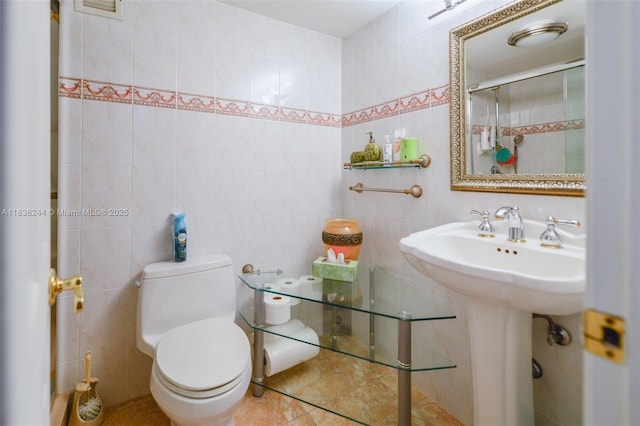 2751 S Ocean Dr Unit 1707S, Hollywood, FL 33019 - bathroom with tile walls, an enclosed shower, and tile patterned floors