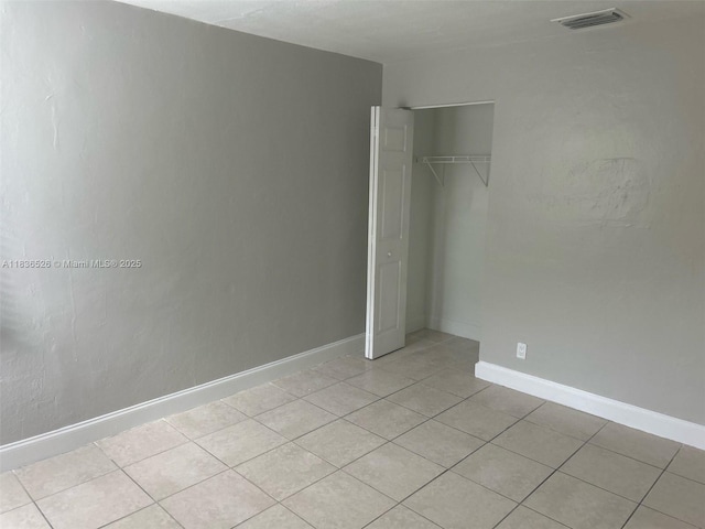 5456 NW 1st Ave, Oakland Park, FL 33309 - unfurnished bedroom featuring light tile patterned floors and a closet