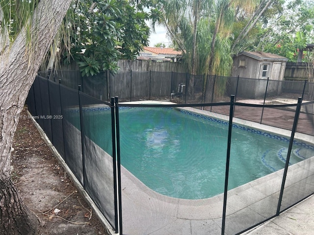 5456 NW 1st Ave, Oakland Park, FL 33309 - view of pool with a fenced backyard and an outbuilding