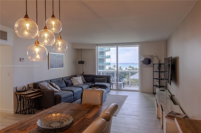 10275 Collins Ave Unit 634, Bal Harbour, FL 33154 - living room featuring floor to ceiling windows and light wood-type flooring