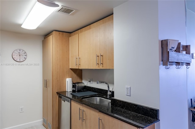 10275 Collins Ave Unit 634, Bal Harbour, FL 33154 - kitchen featuring stainless steel dishwasher, light brown cabinetry, and dark stone countertops