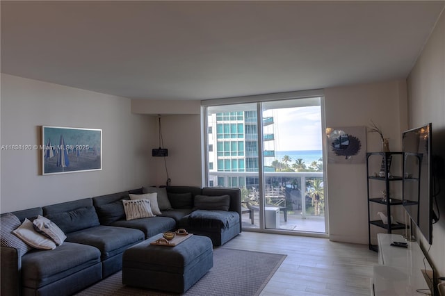 10275 Collins Ave Unit 634, Bal Harbour, FL 33154 - living room featuring light wood-type flooring and expansive windows