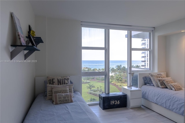 10275 Collins Ave Unit 634, Bal Harbour, FL 33154 - bedroom with a water view and wood finished floors