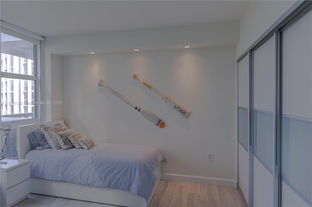 10275 Collins Ave Unit 634, Bal Harbour, FL 33154 - bedroom with light wood-style floors, a closet, and recessed lighting