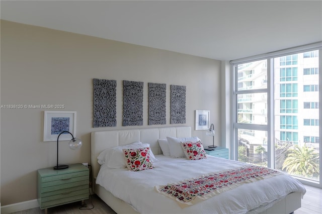10275 Collins Ave Unit 634, Bal Harbour, FL 33154 - bedroom with wood finished floors and a wall of windows