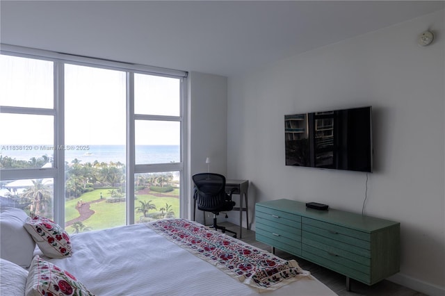 10275 Collins Ave Unit 634, Bal Harbour, FL 33154 - bedroom featuring baseboards and wood finished floors