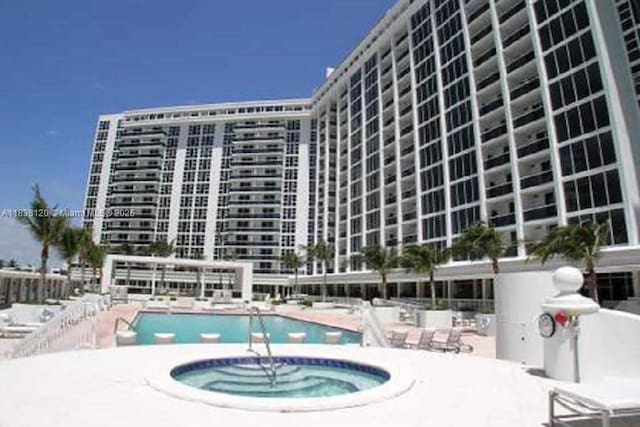 10275 Collins Ave Unit 634, Bal Harbour, FL 33154 - community pool featuring a patio