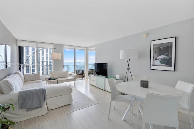 555 NE 15th St Unit 11D, Miami, FL 33132 - living room with floor to ceiling windows and light wood-type flooring