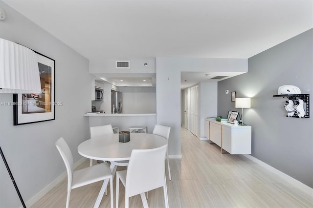 555 NE 15th St Unit 11D, Miami, FL 33132 - dining room featuring baseboards