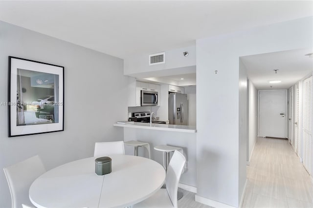 555 NE 15th St Unit 11D, Miami, FL 33132 - dining space with baseboards