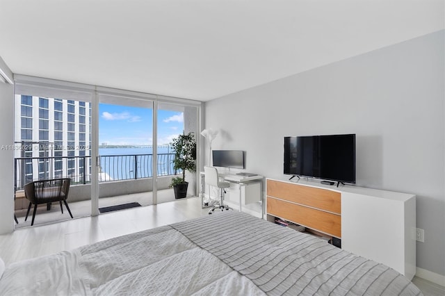 555 NE 15th St Unit 11D, Miami, FL 33132 - bedroom featuring a wall of windows and access to outside