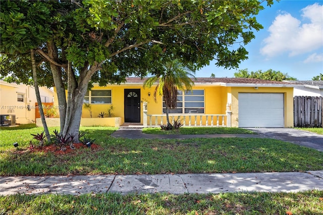 9540 NW 25th St, Sunrise, FL 33322 - view of front of house featuring an attached garage, stucco siding, and driveway