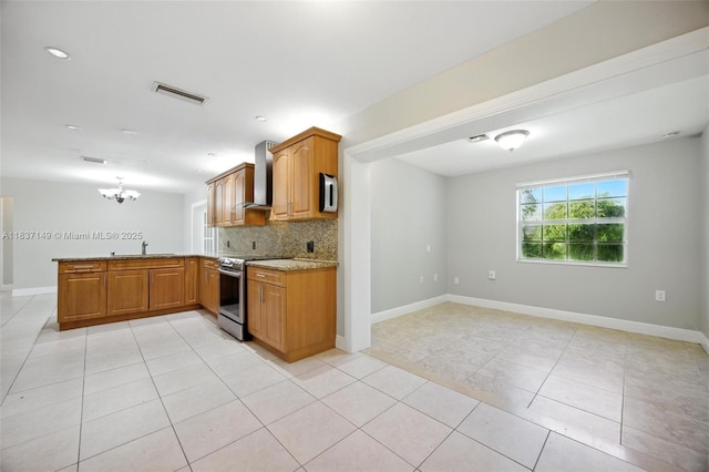 9540 NW 25th St, Sunrise, FL 33322 - kitchen featuring a peninsula, electric stove, decorative backsplash, a chandelier, and light tile patterned floors