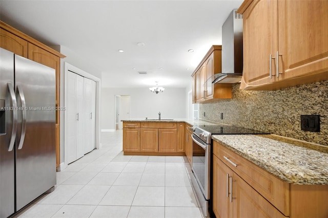9540 NW 25th St, Sunrise, FL 33322 - kitchen with stainless steel appliances, a peninsula, tasteful backsplash, wall chimney exhaust hood, and light tile patterned flooring