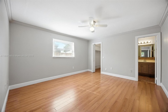 9540 NW 25th St, Sunrise, FL 33322 - unfurnished bedroom with ornamental molding, light wood-type flooring, ensuite bath, a spacious closet, and a ceiling fan