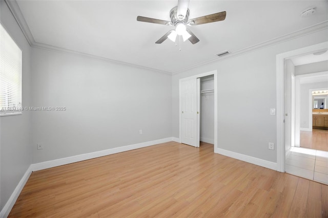 9540 NW 25th St, Sunrise, FL 33322 - unfurnished bedroom with light wood-type flooring, a closet, crown molding, and a ceiling fan