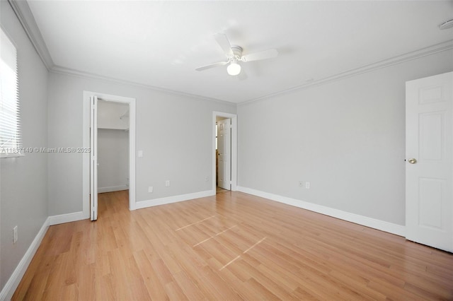9540 NW 25th St, Sunrise, FL 33322 - unfurnished bedroom with light wood-style floors, crown molding, a spacious closet, and a ceiling fan