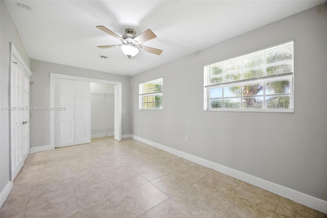 9540 NW 25th St, Sunrise, FL 33322 - unfurnished bedroom with ceiling fan and light tile patterned floors