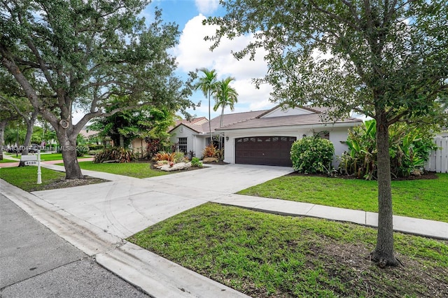 4125 SW 152nd Ave, Miramar, FL 33027 - single story home with a garage, driveway, a front lawn, stucco siding, and a tiled roof