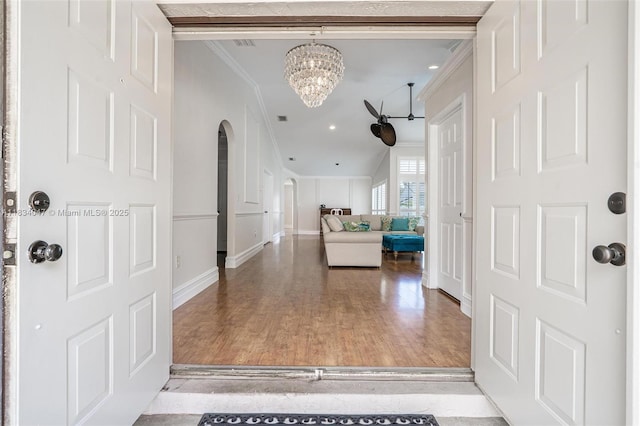 4125 SW 152nd Ave, Miramar, FL 33027 - entrance foyer with crown molding, a chandelier, arched walkways, wood finished floors, and recessed lighting