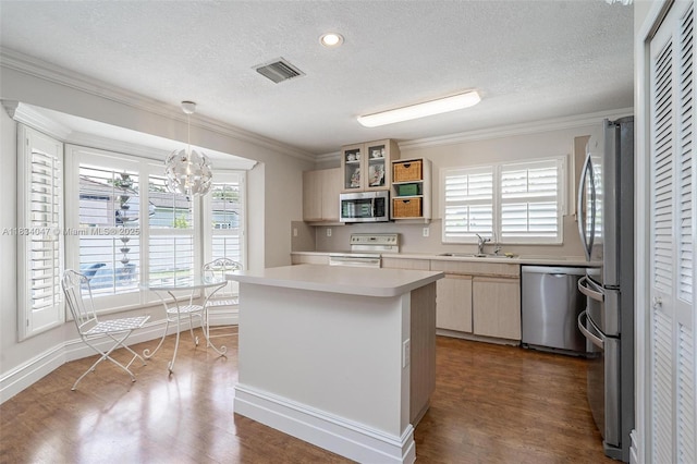4125 SW 152nd Ave, Miramar, FL 33027 - kitchen with stainless steel appliances, a textured ceiling, ornamental molding, light countertops, and a chandelier