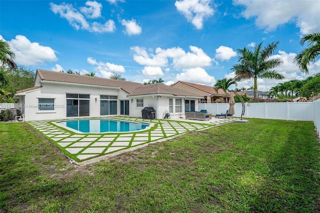 4125 SW 152nd Ave, Miramar, FL 33027 - rear view of property featuring a patio area, stucco siding, a fenced backyard, and an outdoor living space