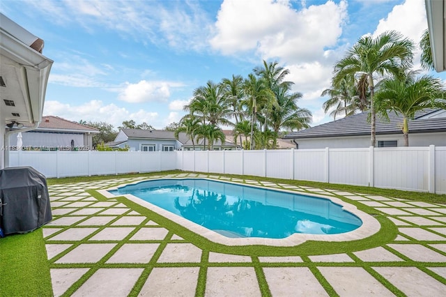 4125 SW 152nd Ave, Miramar, FL 33027 - view of swimming pool with a patio, area for grilling, and a fenced backyard