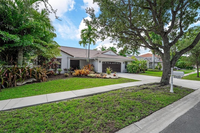 4125 SW 152nd Ave, Miramar, FL 33027 - ranch-style home featuring a garage, concrete driveway, stucco siding, and a front lawn