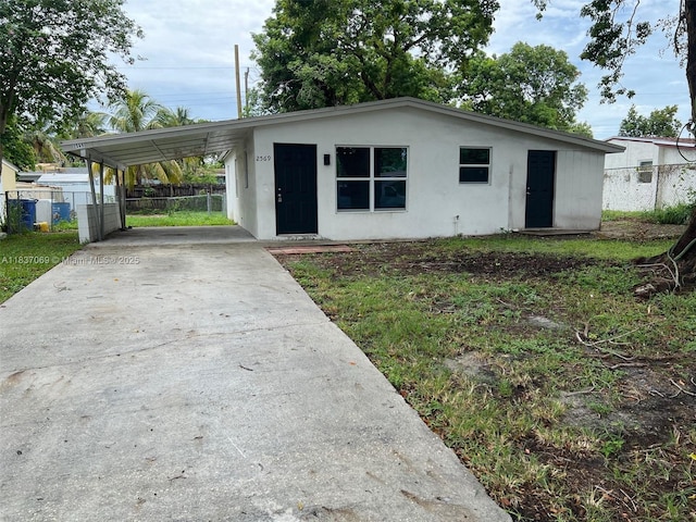 2569 NW 61st Ave, Margate, FL 33063 - view of front of home featuring concrete driveway, stucco siding, and a carport
