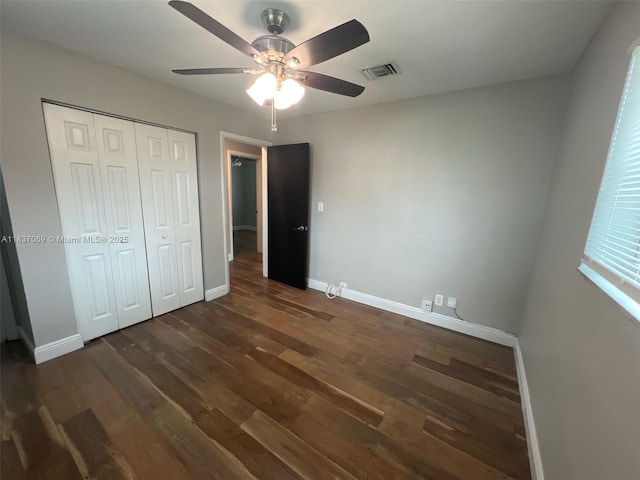 2569 NW 61st Ave, Margate, FL 33063 - unfurnished bedroom with dark wood-type flooring, a closet, and a ceiling fan