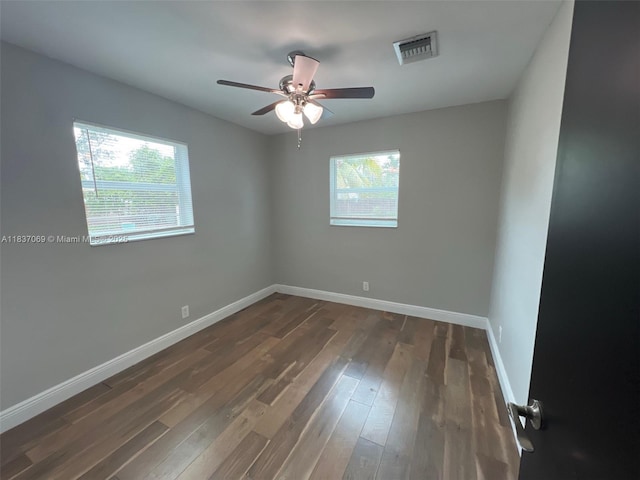 2569 NW 61st Ave, Margate, FL 33063 - empty room with a ceiling fan and dark wood-type flooring