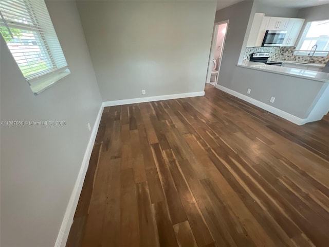 2569 NW 61st Ave, Margate, FL 33063 - unfurnished living room with dark wood finished floors
