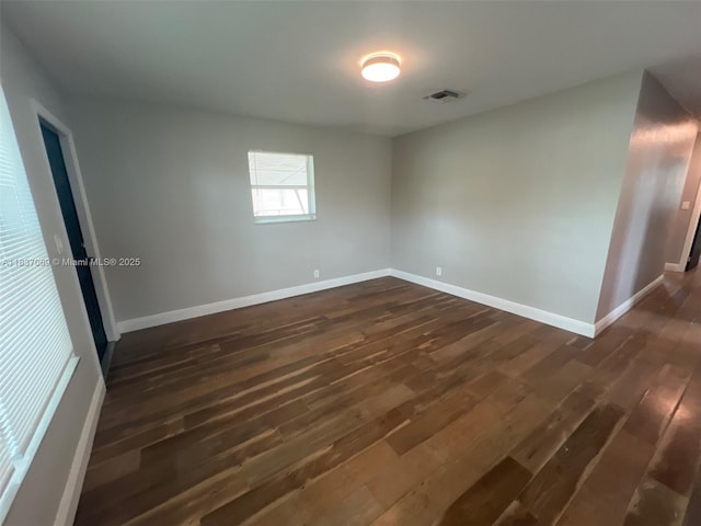 2569 NW 61st Ave, Margate, FL 33063 - spare room featuring dark wood-type flooring and baseboards