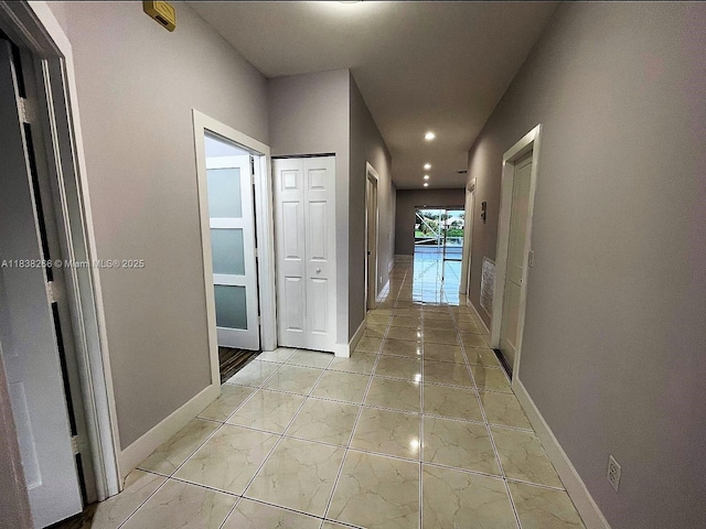 10824 Fillmore Dr, Boynton Beach, FL 33437 - corridor with recessed lighting and light marble finish flooring