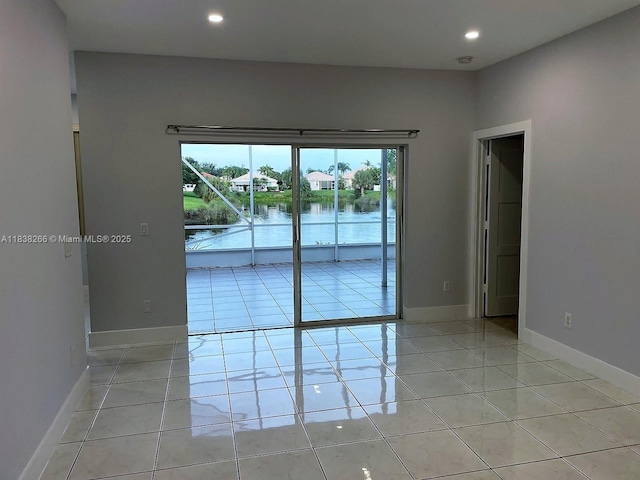 10824 Fillmore Dr, Boynton Beach, FL 33437 - unfurnished room with light tile patterned floors, recessed lighting, and a water view