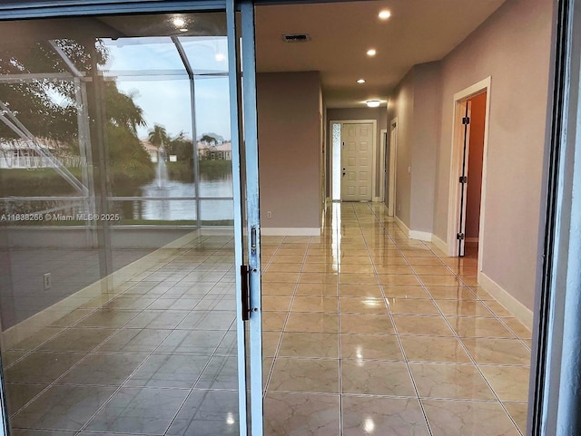 10824 Fillmore Dr, Boynton Beach, FL 33437 - hallway with recessed lighting, a water view, and light tile patterned floors