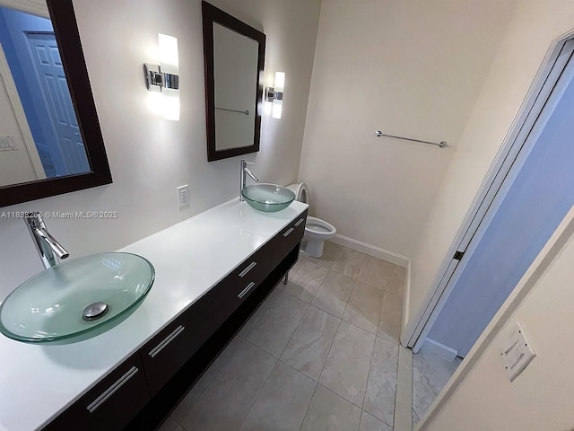 10824 Fillmore Dr, Boynton Beach, FL 33437 - bathroom with double vanity and marble look tile flooring
