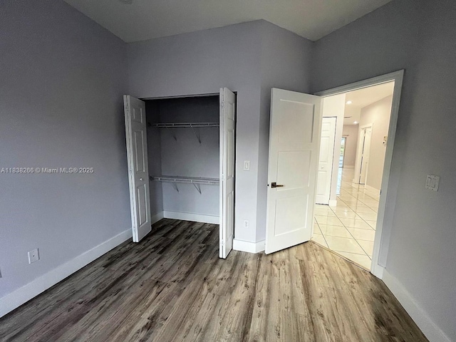 10824 Fillmore Dr, Boynton Beach, FL 33437 - unfurnished bedroom with wood finished floors and a closet