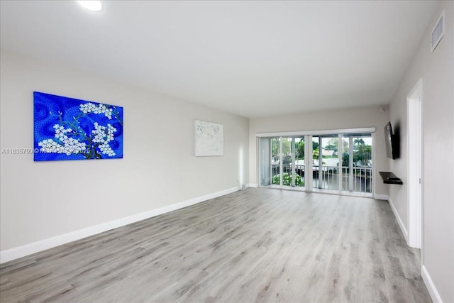 1200 SW 12th St Unit 214, Fort Lauderdale, FL 33315 - spare room featuring wood finished floors and baseboards