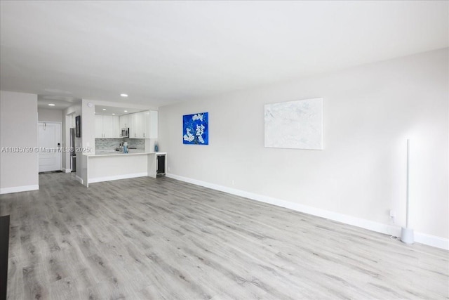 1200 SW 12th St Unit 214, Fort Lauderdale, FL 33315 - unfurnished living room with recessed lighting and light wood-type flooring