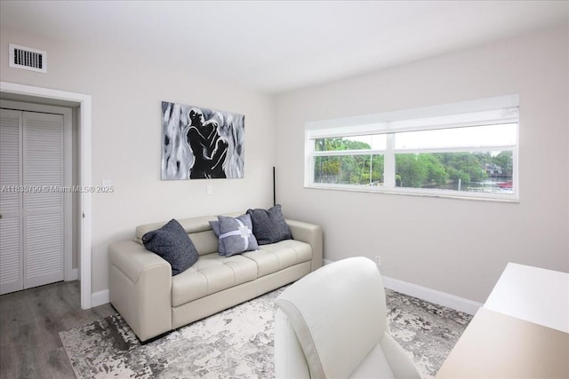 1200 SW 12th St Unit 214, Fort Lauderdale, FL 33315 - living area with baseboards and wood finished floors