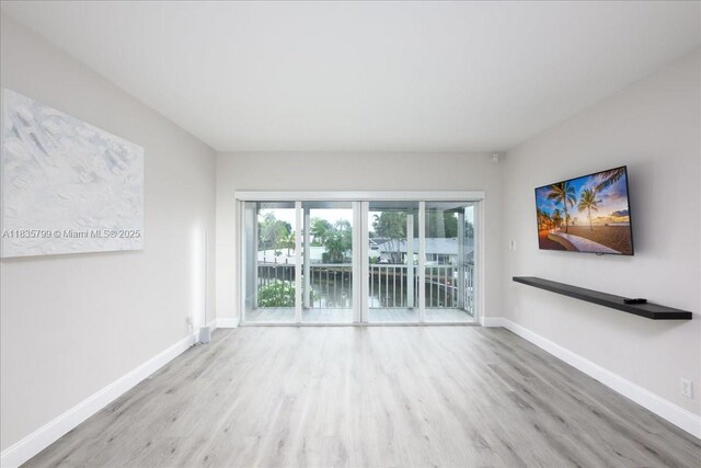 1200 SW 12th St Unit 214, Fort Lauderdale, FL 33315 - unfurnished room featuring wood finished floors and baseboards